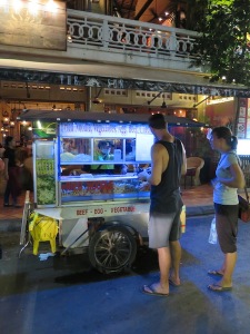 Rich buying dinner at the noodle street food vendor